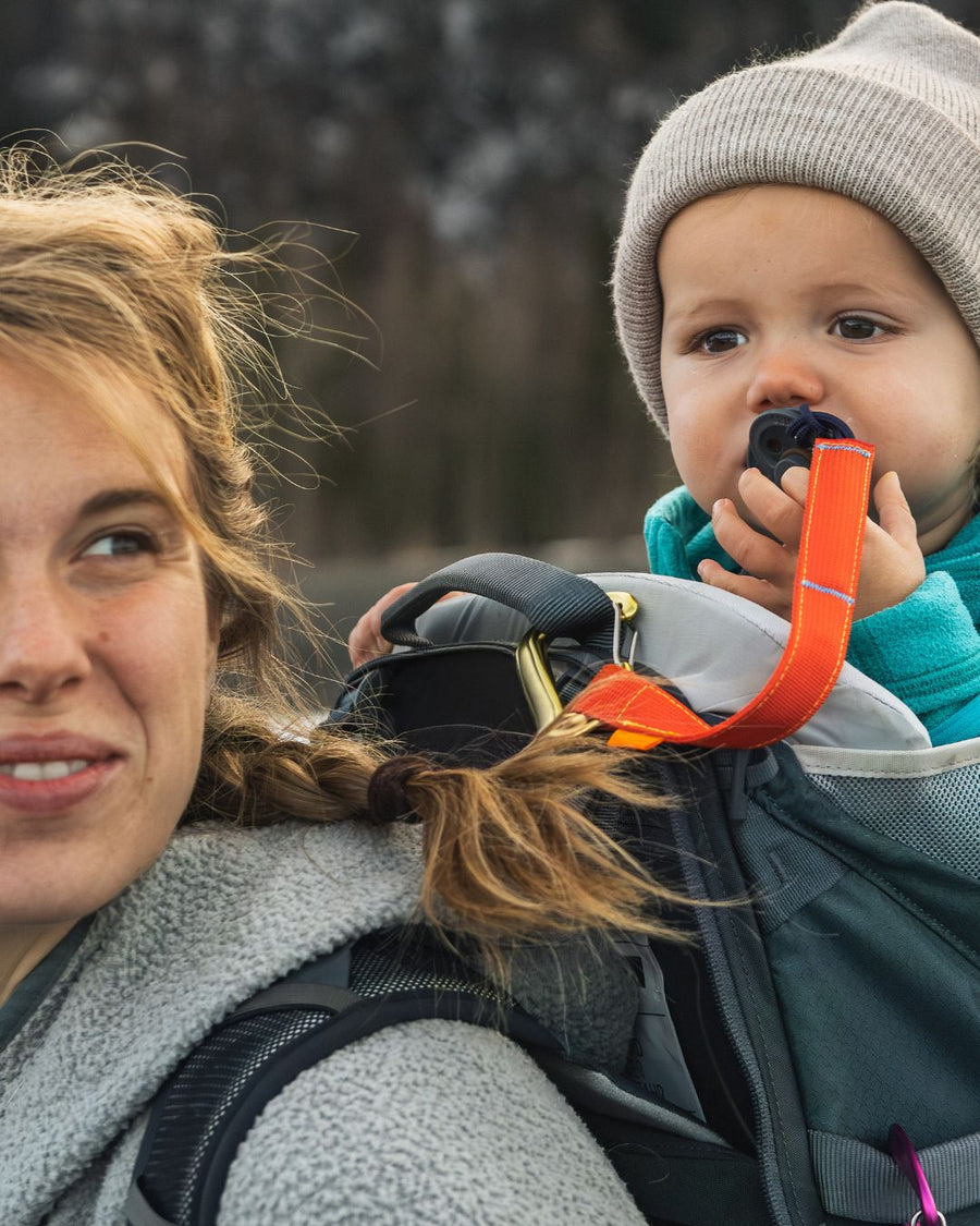 Trail Tether clipped to a hiking child carrier