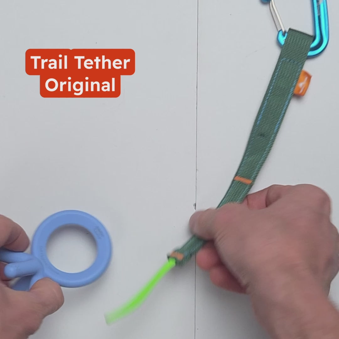A product video that shows the uses of the trail tether ecosystem using mainly hands showing how the product works for securing toys, soothers, water bottles, keys, stroller items, in combination with chameleon rings and tether max